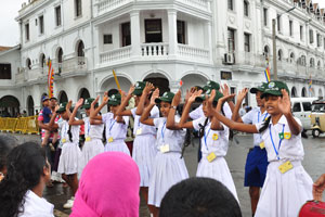 A school dance group performs a dance