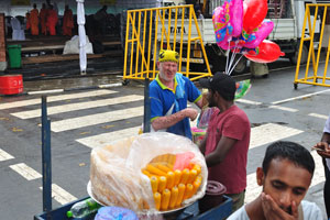 Vendors sell toys and corn cobs