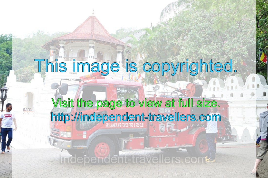 A fire engine is located beside the temple of the Sacred Tooth Relic