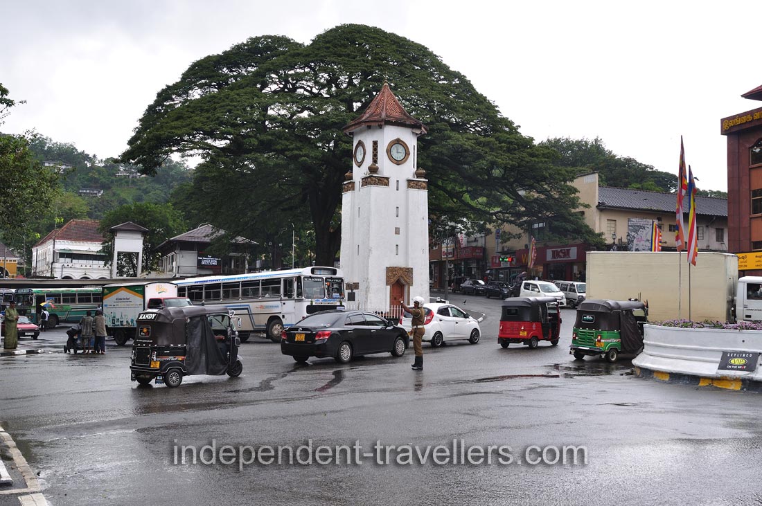 A policeman is near Kandy Clock Tower