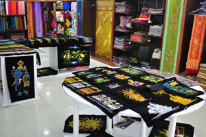 Fabrics with national patterns are for sale in Lanka Silks store