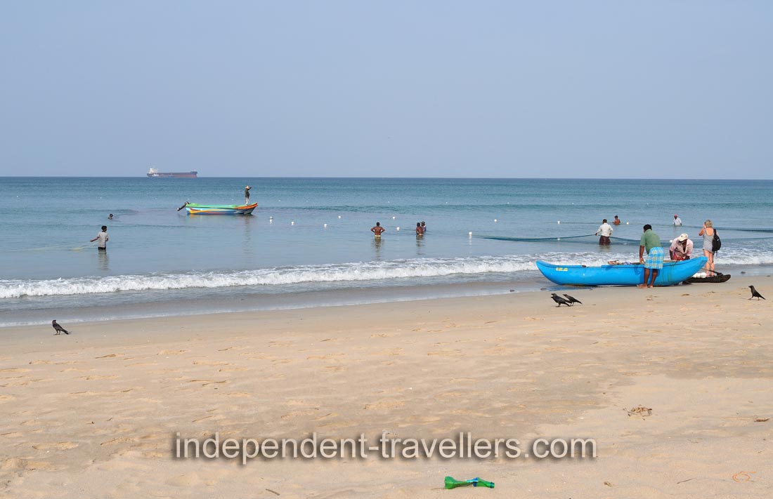 Fishermen and fishing nets are in the water