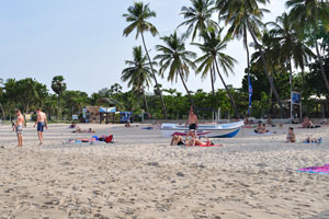People are sunbathing on Uppuveli beach