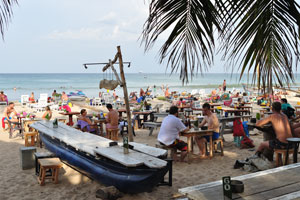 Fernando's Beach Bar features an outdoor dining table in the shape of a boat with a sail