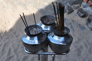 Thin lighted candles with incense