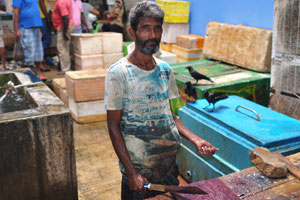 A man who cleans fish at the fish market