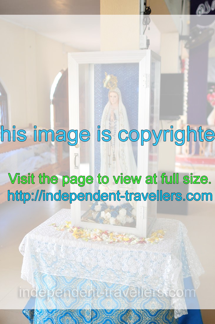 The figurine of Virgin Mary is in Divine Mercy Shrine catholic church