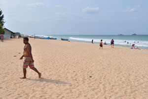 A vast sandy beach on a sunny summer day