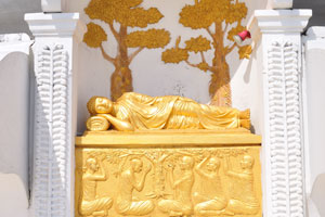 A sleeping golden statue of Japanese Peace Pagoda