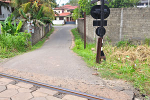 Thalpe Road intersects a railway track in this place