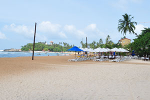 Parasols and loungers are on the beach
