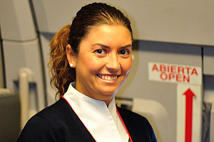 A lovely flight attendant from the Iberia (IB) airline is on the flight from Moscow to Madrid