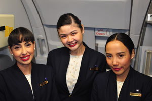 Three beauteous flight attendants