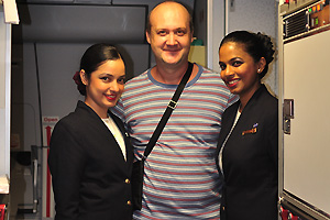 It is me with two flight attendants on the QR flight from Moscow to Doha
