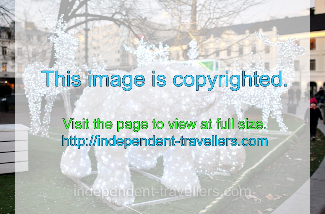 An artificial white bear covered with Christmas lightings is placed on Gustav Adolfs Torg square