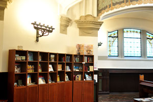 This is the library with a lampstand above it on the wall in St. John's Church