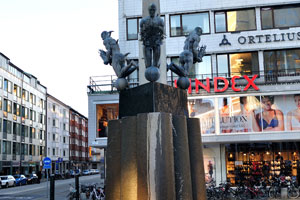 The monument with a fountain on Triangeln square is located in front of Lindex clothing store