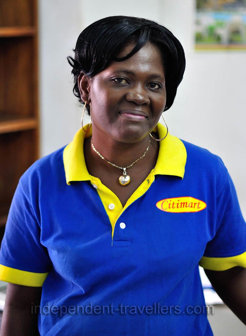 A female cashier that works in the Supermarche Citimart