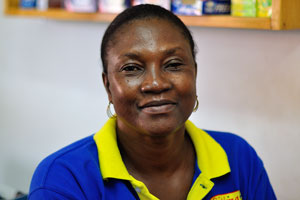 A portrait of a female cashier that works in the Supermarche Citimart