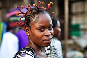 A charming Togolese girl wears a fantastic hairstyle