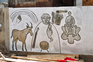 Fence is covered with different drawings at the Akodessewa Voodoo Market