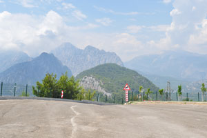 An inscription below the road sign reads “Yavas”