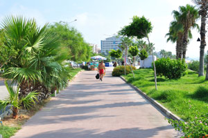 The esplanade of Konyaalti Beach is decorated with green plants