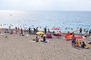 Konyaalti Beach is full of sunbathers in July and August