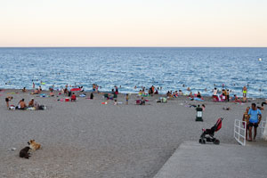 People rest and swim on Konyaalti Beach until late