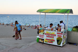 A small stall selling corn cups is situated near the beach