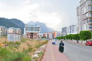 A muslim woman walks down 153 street (Turkish: 153. Sokak)