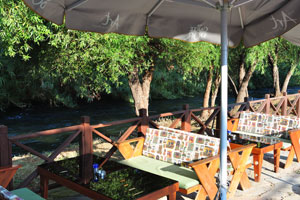 A cafe features a pleasant atmosphere with gurgling water of the Düden River