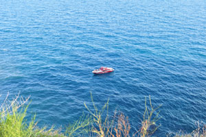 A lonely boat is in the Mediterranean Sea