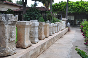 The open-air exhibition area features ancient altars