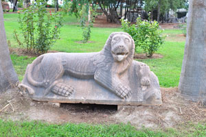 A stone relief depicting a lion with hippo behind