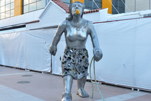 A contemporary statue is installed at the entrance to the shopping centre
