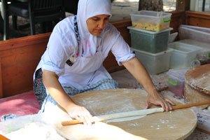 Two women are cooking homemade Turkish food