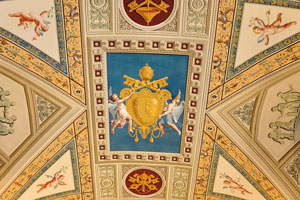 Yellow papal coat of arms is on the ceiling of the Vatican Apostolic Library