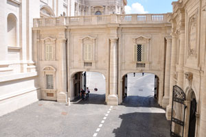 A pure white building is equipped with two gates