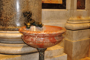 The tiny sink with two dragons is in St. Peter's Basilica