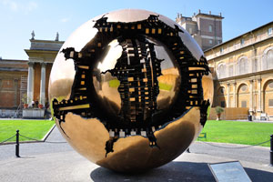 The sculpture of two concentric spheres by Arnaldo Pomodoro is in the middle of Cortile della Pigna