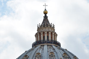 Numerous tourists are on the top of the dome of St. Peter's Basilica