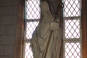 The statue of an arbishop is inside St. Mary's Cathedral Basilica
