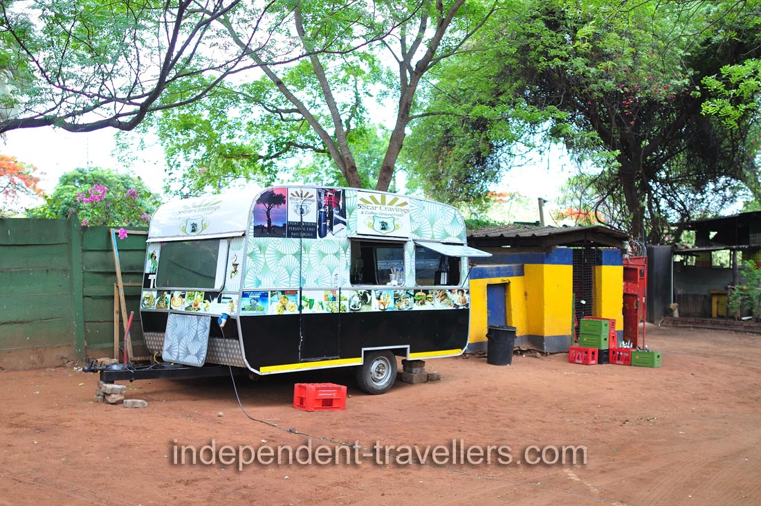 The mobile coffee van is located at the Shoestrings Backpackers Lodge