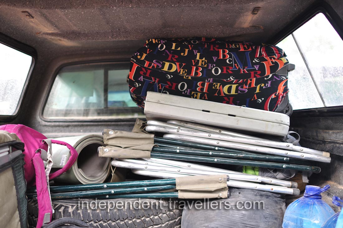 My suitcase is inside the Toyota Hilux 4x4 rear cargo area