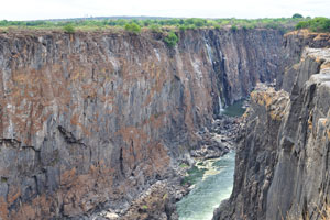 The water from Victoria Falls dives into a narrow gorge running parallel to the face of the falls